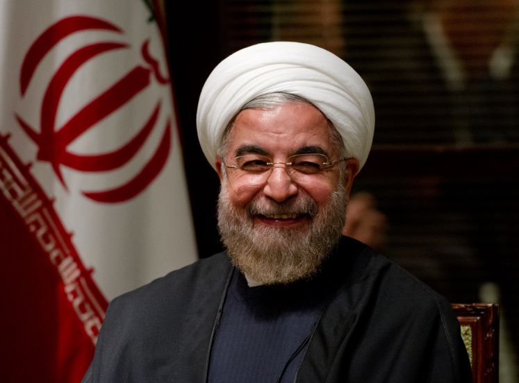 Der Iranische Präsident Hassan Rohani lächelt in die Kamera