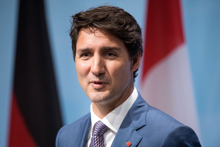 Justin Trudeau lächelnd bei einer Rede