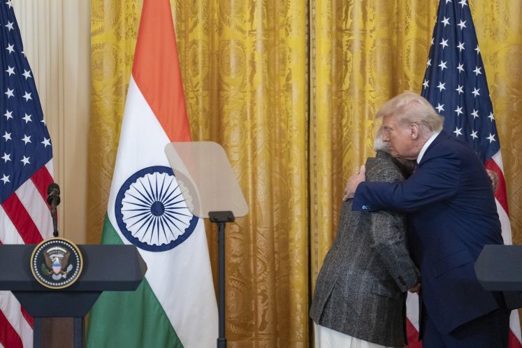 Indian Prime Minister Narendra Modi, left, embraces U.S President Donald Trump,